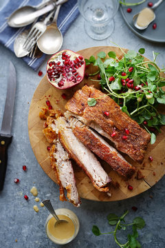 14 hours slow roasted pork belly with watercress and pomegranate salad.