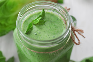 Healthy smoothie with kale in mason jar, closeup