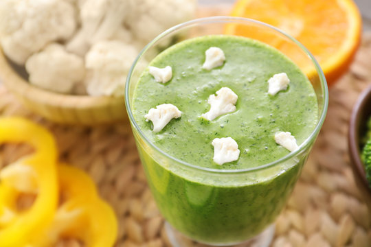 Healthy smoothie with kale in glass, closeup