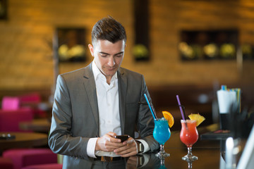 Happy businessman in cafe