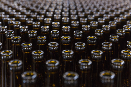 Symmetrical Rows Of Empty Beer Bottles Shot From Above