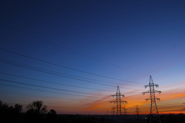 Beautiful red sunset and high-voltage lines
