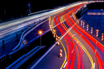 a construction site on a highway at night