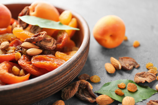 Dried apricots, raisins and nuts in bowl on table