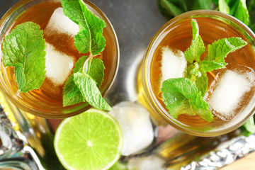 Two glasses with mint julep on metal tray