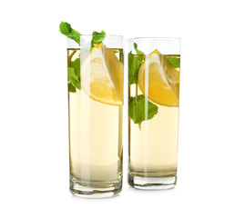 Two glasses with mint julep on white background