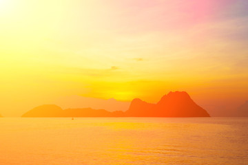 Bright colors at dawn on the beach at sunrise in the Gulf of Thailand.