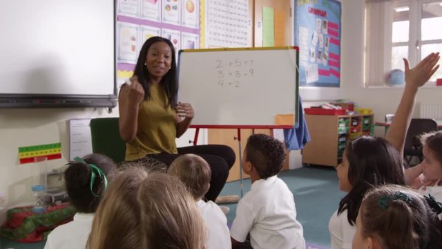 Pupils Writing Answer To Maths Problem On Board Shot On R3D