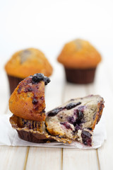 blueberry muffins in a rustic style.