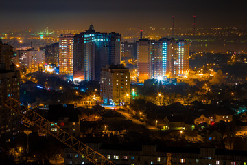 Fototapeta na wymiar Night Voronezh. Aerial view to high modern buildings 