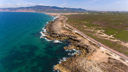 Fototapeta premium Stunning road along the beautiful coast of the Atlantic Ocean in Portugal. aerial view from Drone