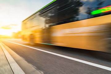 Fototapeta na wymiar Blurred bus on the road in the city