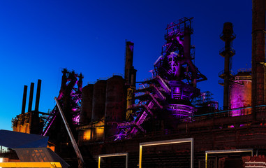 Steel stacks with purple and yellow lighting as entertainment area in downtown Bethlehem Pa.