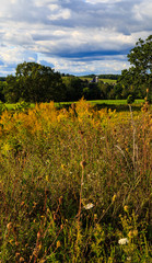 Hudson Valley skyline with farm land and meadows on a cloud filled summer day.