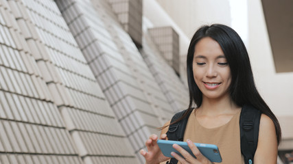 Woman taking photo with cellphone