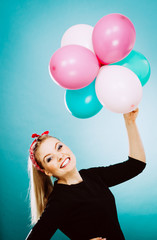 Fototapeta na wymiar Teen joyful girl playing with colorful balloons
