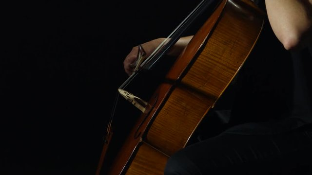 Professional cellist playing her instrument.