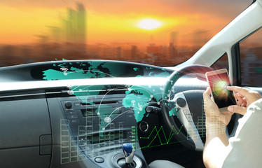 man use cell-phone connect to intelligent car or  futuristic vehicle and graphical user interface connected car. Internet of Things. Heads up display(HUD).