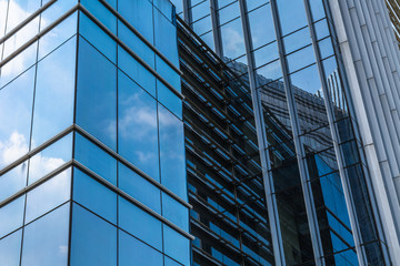 Fototapeta na wymiar Abstract building. blue glass wall of skyscraper.