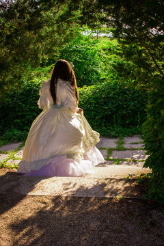 girl in white dress running away