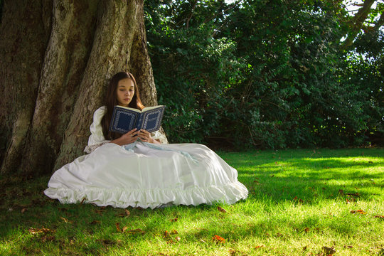Girl reading in woods 2