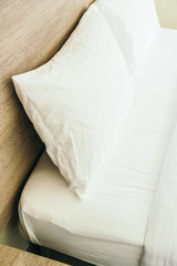 Fototapeta na wymiar White pillow on bed