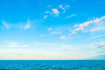 Naklejka na ściany i meble White cloud on blue sky with sea and ocean
