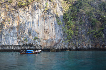 a long tail boat floating in phiphi island,Thailand 