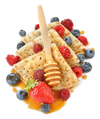 French crepes with berries and honey