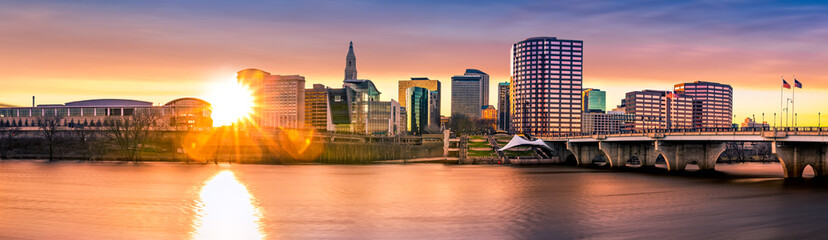 Hartford skyline and Founders Bridge at sunset. Hartford is the capital of Connecticut. - obrazy, fototapety, plakaty