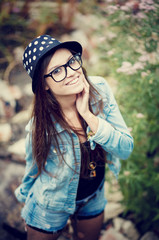young female smiling wearing glasses vintage tone
