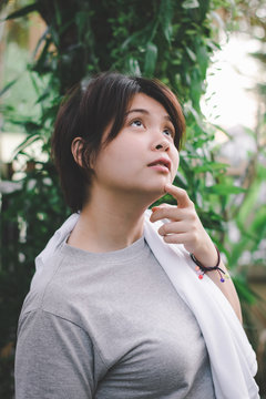 Close Up Of Young Asain Woman Feeling Relax In The Garden.