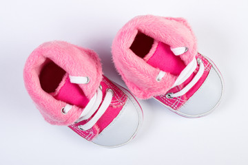 Pair of baby shoes on white background, expecting for newborn concept