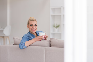 woman enjoying a cup of coffee