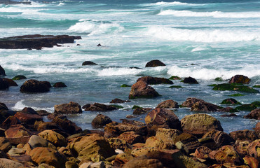 Waves crashing over sandstone rocks and platforms on NSW coast at Garie Beach, Royal National Park, Sydney