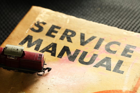 Model railroad scene put on the old service manual book.