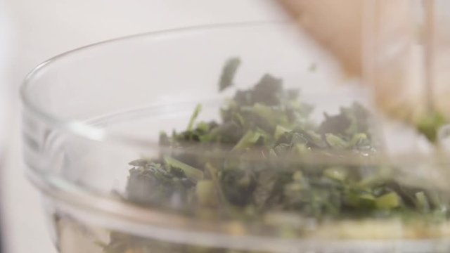 Close up, chef mixes ingredients for vegetable pate in bowl