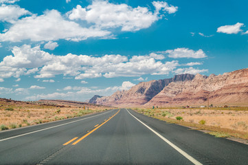 Stone desert in the USA. Red rocks of Arizona and highway