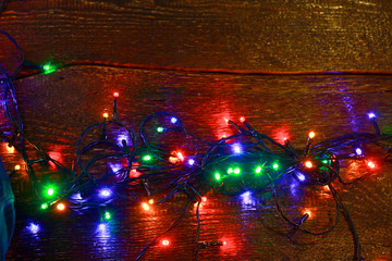 Christmas rustic background - vintage planked wood with lights and free text space