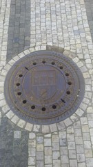 Manhole cover on a street in Prague