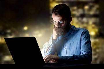 Businessman in the office at night