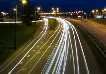 Fototapeta na wymiar Light trails from cars in Riga city. Long exposure photograph at night
