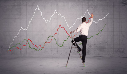 male on ladder drawing chart lines
