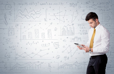 Salesman standing with drawn graph charts