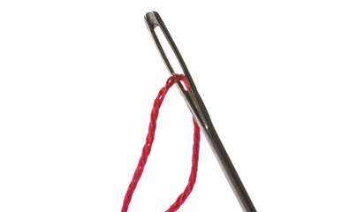red thread in eye of silver needle