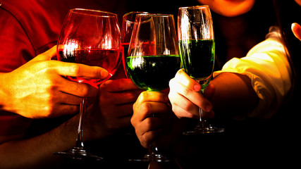 The acting setup of Christmas party concept. The two young couple enjoy together in the Xmas party and all the mambers has a drink to celebrate together.