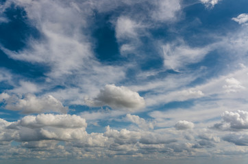 Fototapeta na wymiar Fantastic white clouds against blue sky