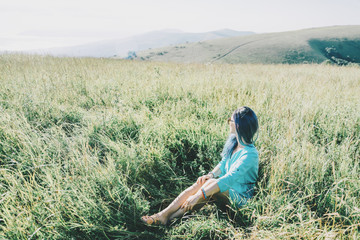 Woman resting on summer meadow.
