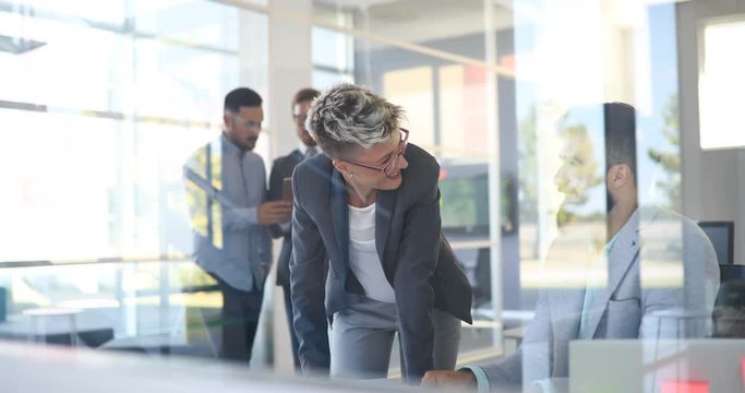 Picture of designers sticking notes in office