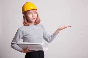 Asian engineer woman with blueprints show her palm hand.